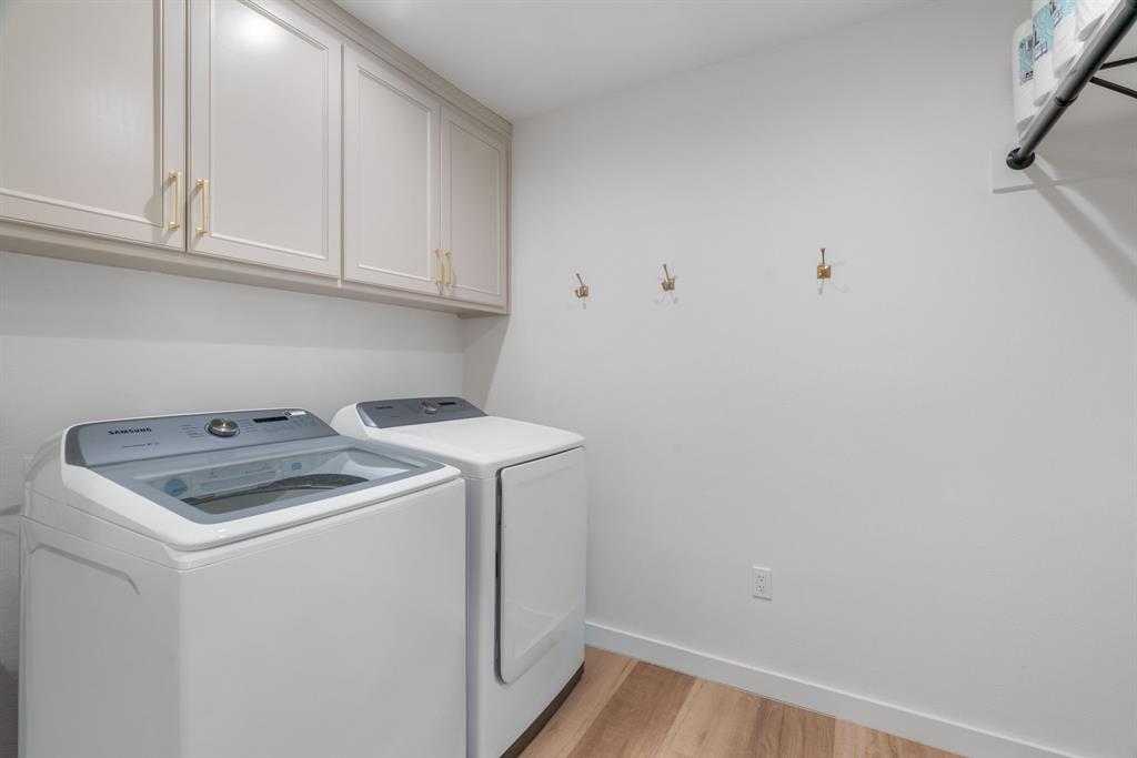 1021 Poe Street Azle, TX 76020 - Photo 31 of 38 a utility room with dryer and washer