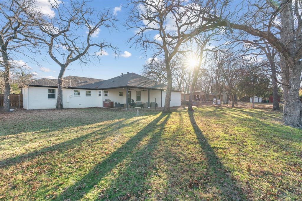1021 Poe Street Azle, TX 76020 - Photo 37 of 38 a view of a house with a yard