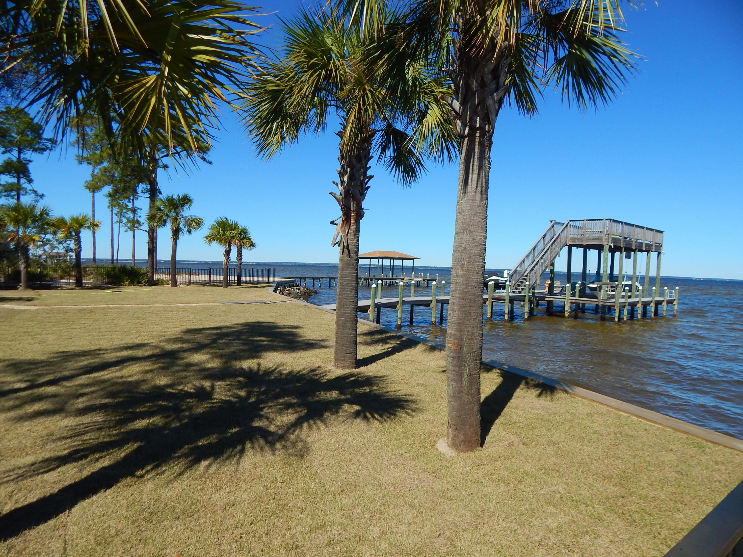 1341 Driftwood Point Road, Unit J4 Santa Rosa Beach, FL 32459 - Photo 5 of 5 a swimming pool with outdoor seating and yard