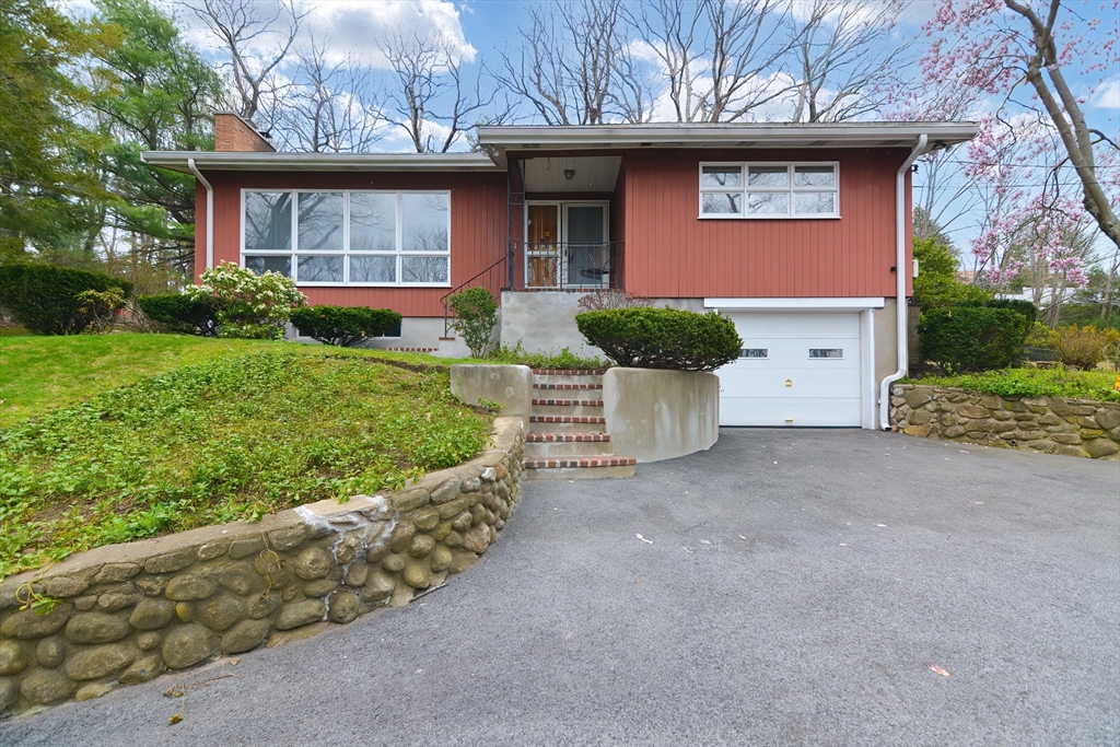 119 Ridge Street Winchester, MA 01890 - Photo 1 of 42 a view of a house with a yard and potted plants