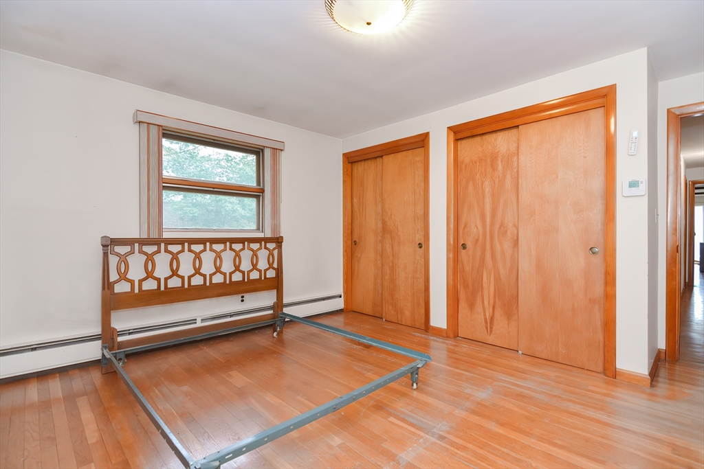 119 Ridge Street Winchester, MA 01890 - Photo 19 of 42 an empty room with wooden floor and windows