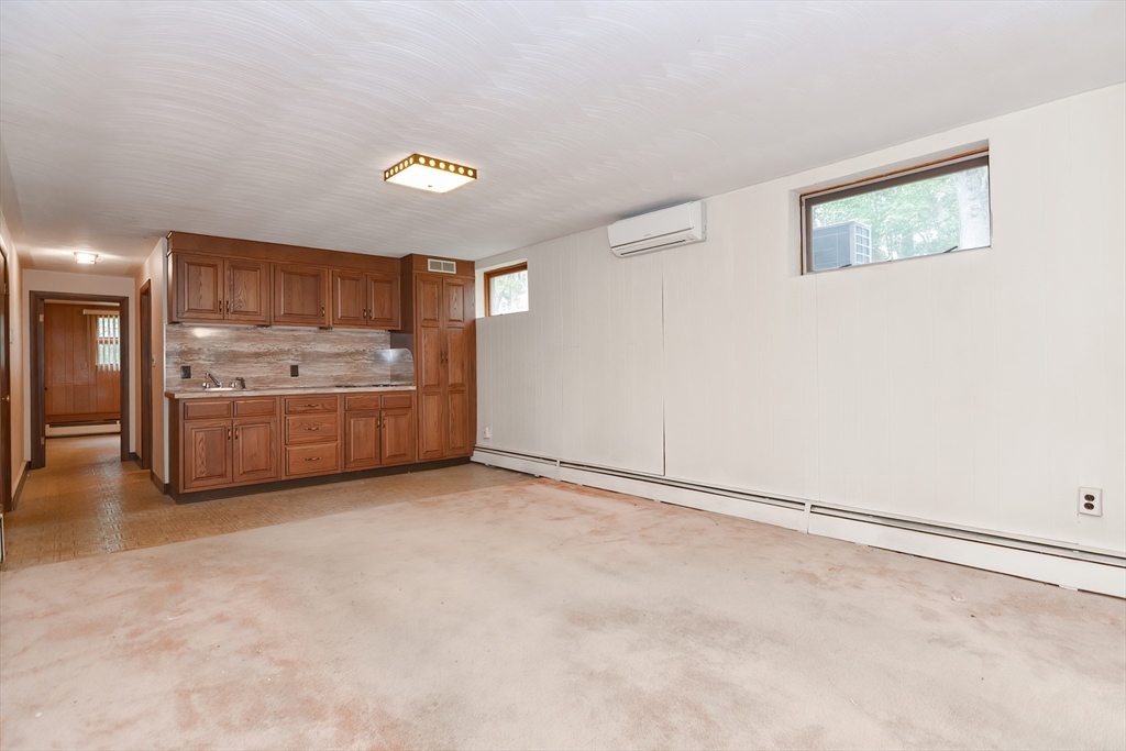 119 Ridge Street Winchester, MA 01890 - Photo 22 of 42 a view of kitchen with granite countertop cabinets and refrigerator
