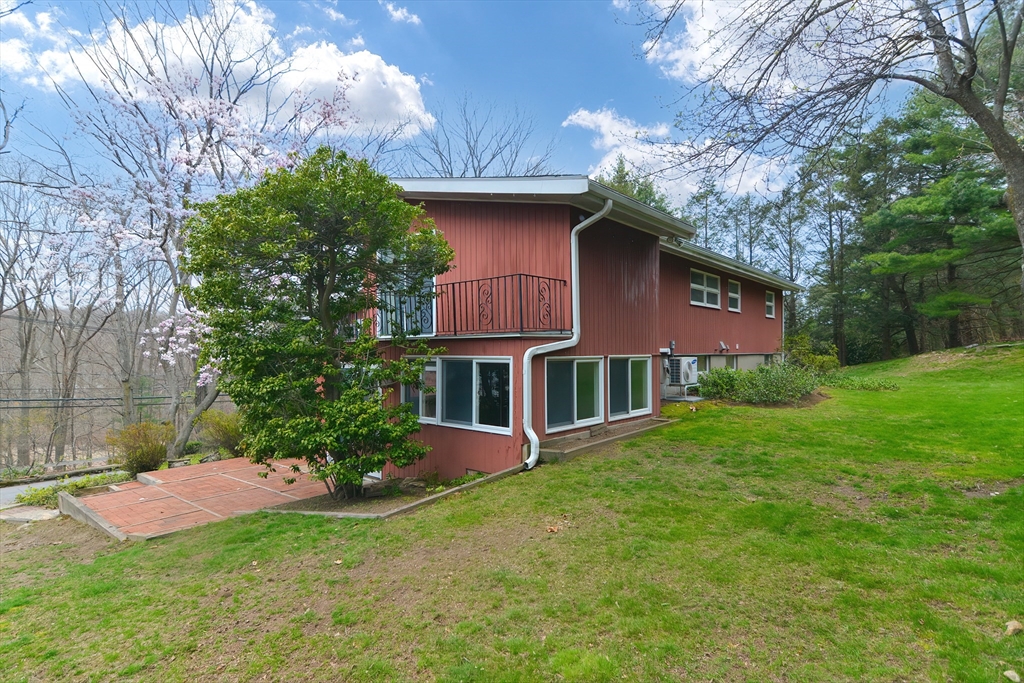 119 Ridge Street Winchester, MA 01890 - Photo 34 of 42 a brick building with a big yard and large trees