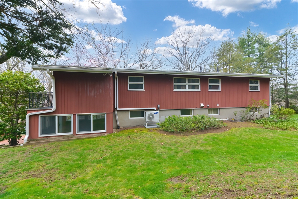119 Ridge Street Winchester, MA 01890 - Photo 36 of 42 a front view of a house with a garden