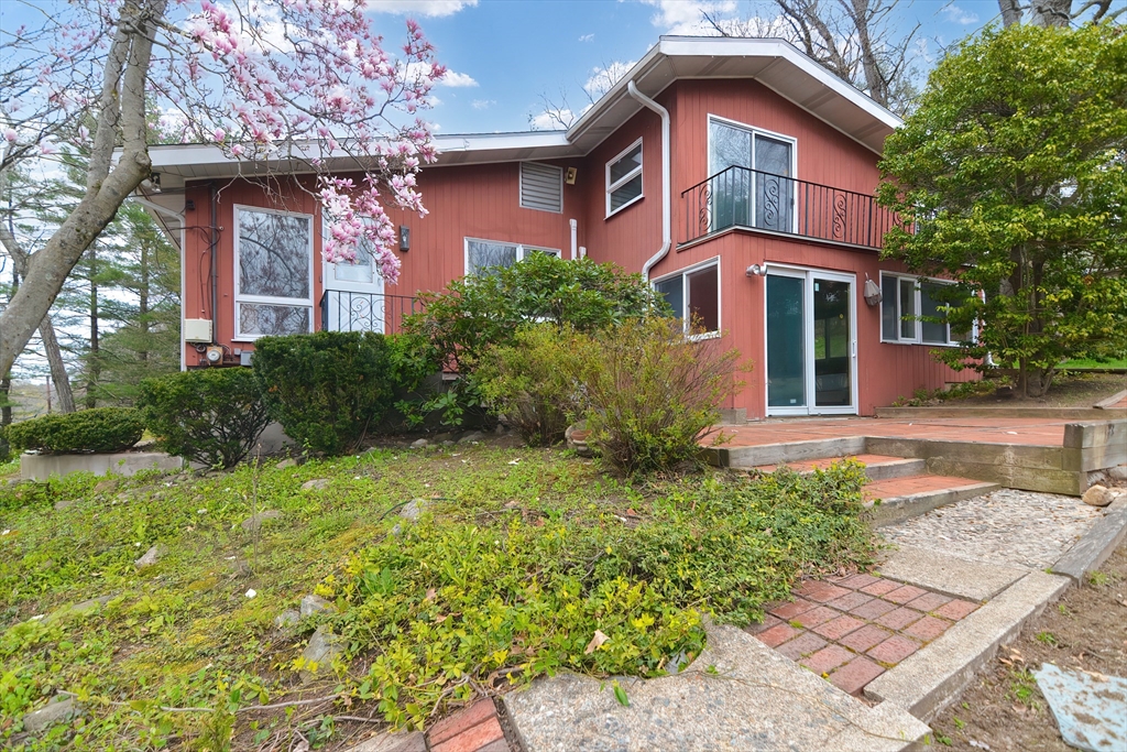 119 Ridge Street Winchester, MA 01890 - Photo 40 of 42 a front view of a house with garden