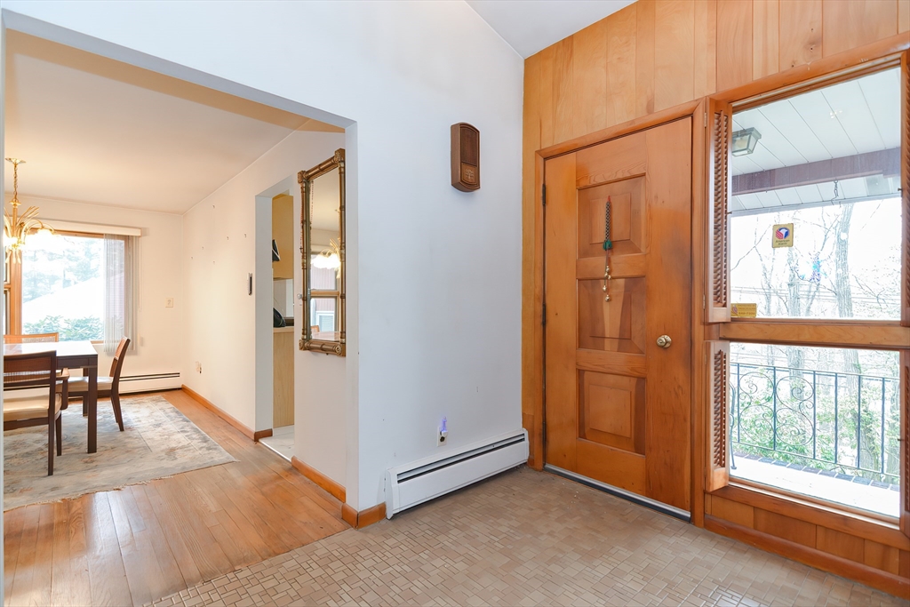 119 Ridge Street Winchester, MA 01890 - Photo 6 of 42 an empty room with windows and wooden floor