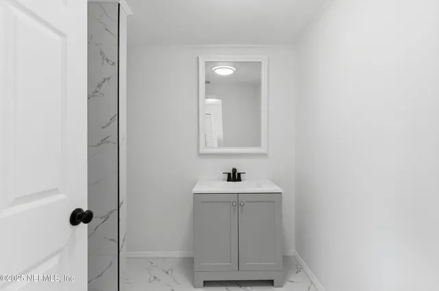 an empty room with wooden floor and closet