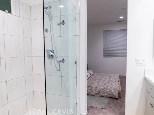 a kitchen with a table chairs a sink and cabinets
