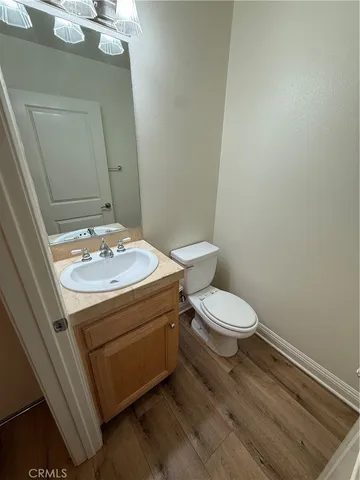 an empty room with a ceiling fan and window