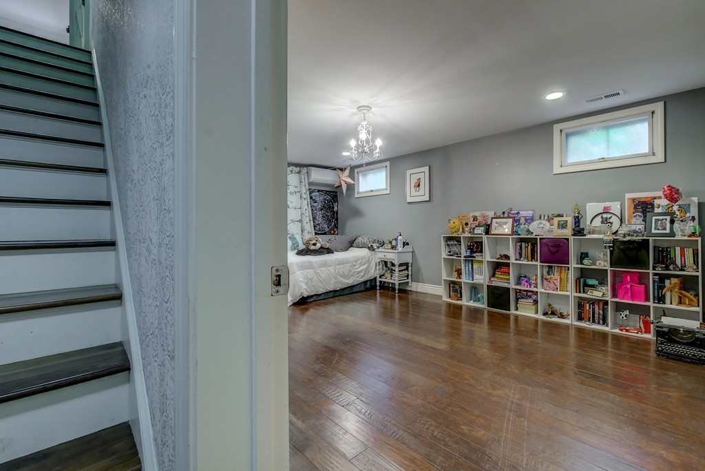 13 Wynridge Road, Unit 13 Windham, NH 03087 - Photo 20 of 29 a living room with lots of furniture and wooden floor