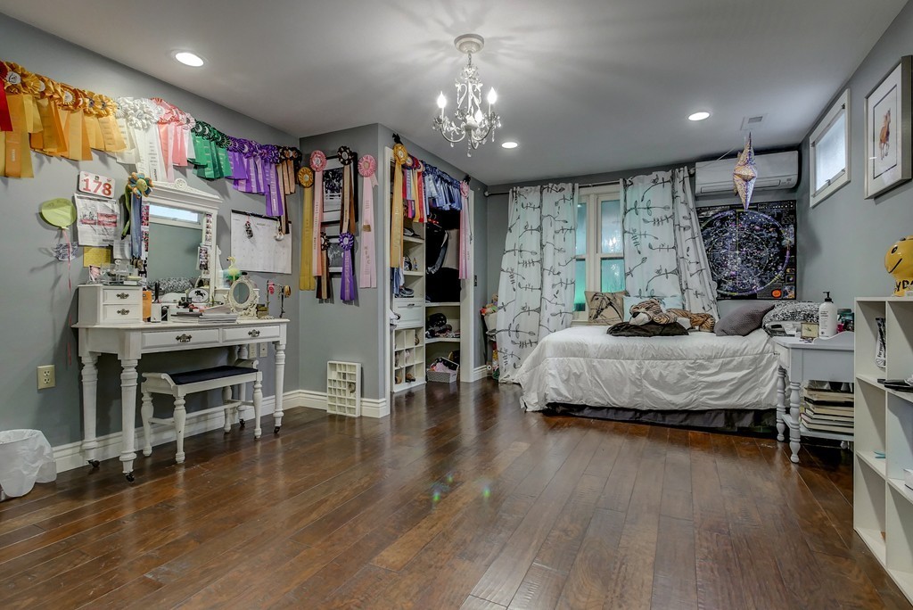 13 Wynridge Road, Unit 13 Windham, NH 03087 - Photo 21 of 29 a bedroom with furniture and a wooden floor