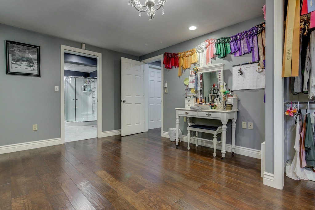 13 Wynridge Road, Unit 13 Windham, NH 03087 - Photo 22 of 29 a view of a room with furniture and wooden floor