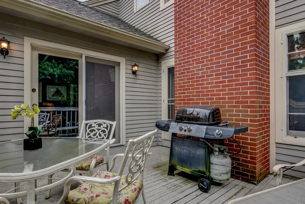 13 Wynridge Road, Unit 13 Windham, NH 03087 - Photo 29 of 29 a backyard of a house with seating space
