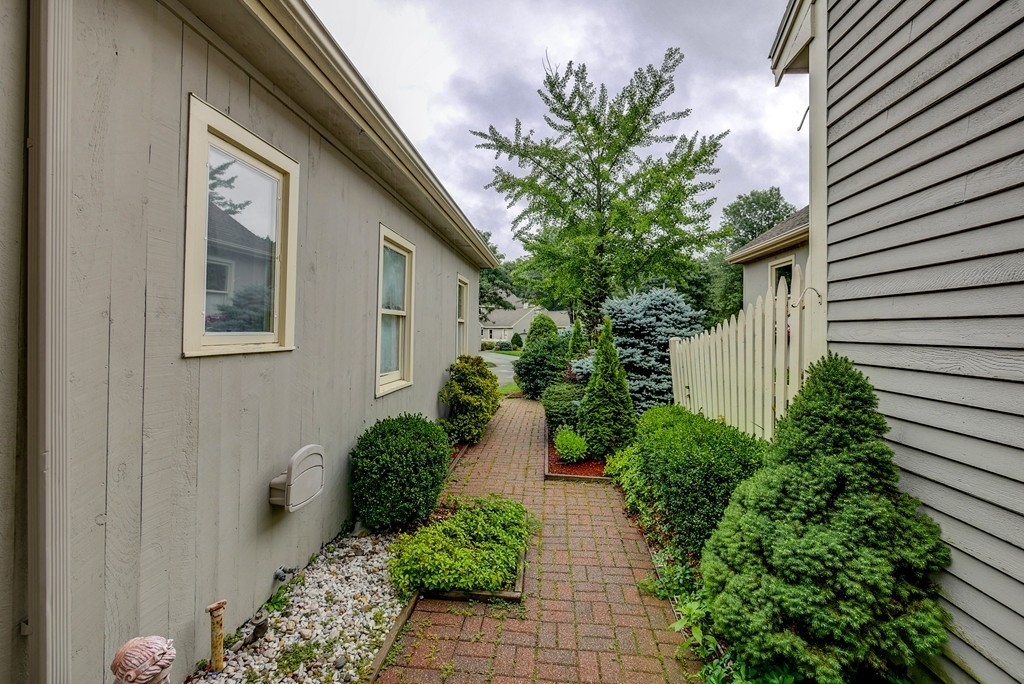 13 Wynridge Road, Unit 13 Windham, NH 03087 - Photo 3 of 29 a view of a house with potted plants