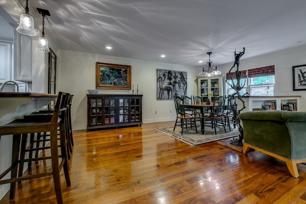 13 Wynridge Road, Unit 13 Windham, NH 03087 - Photo 9 of 29 a living room with furniture and a wooden floor