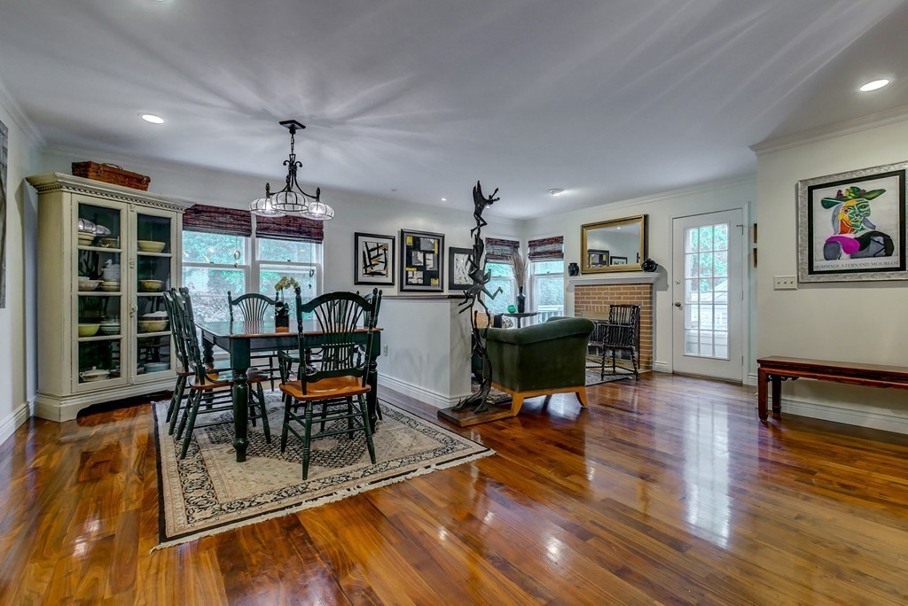 13 Wynridge Road, Unit 13 Windham, NH 03087 - Photo 10 of 29 a living room with furniture a dining table and a fireplace