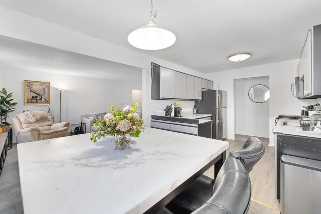 a view of kitchen with cabinets and wooden floor