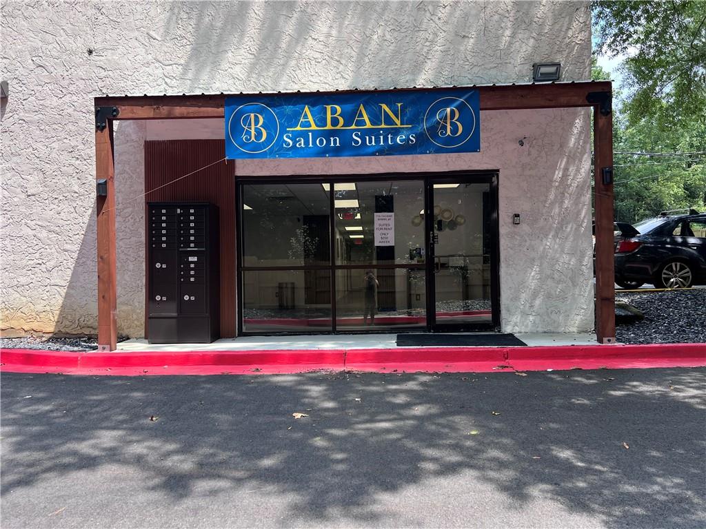 a view of street with retail shops