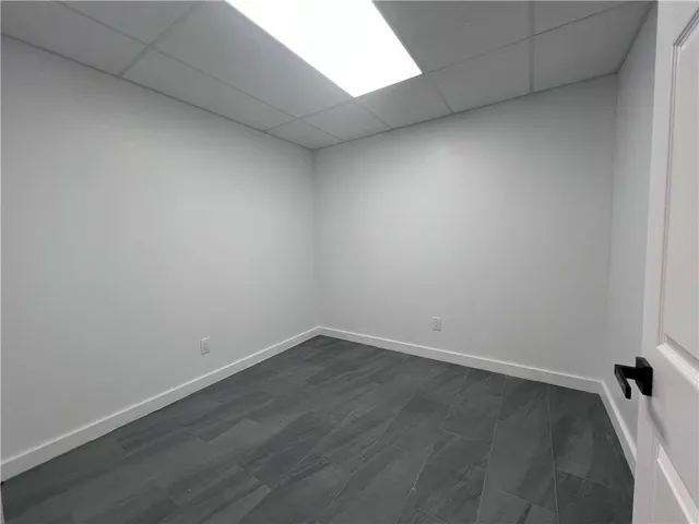 an empty room with wooden floor