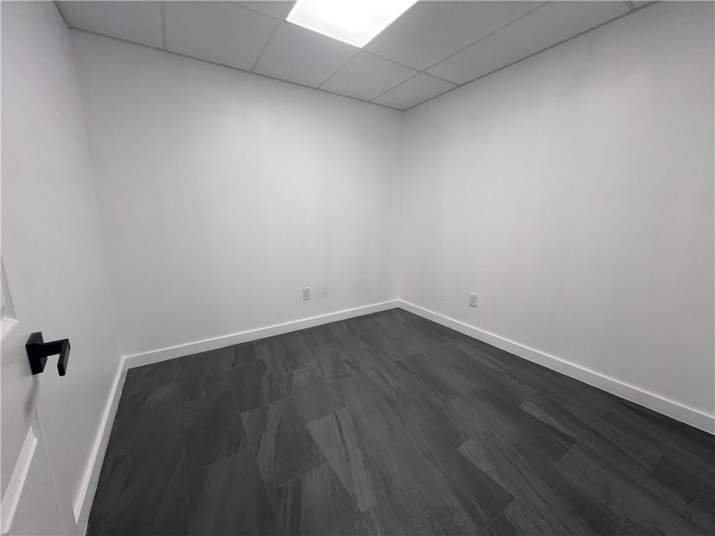 7855 Roswell Road Atlanta, GA 30350 - Photo 19 of 24 an empty room with wooden floor