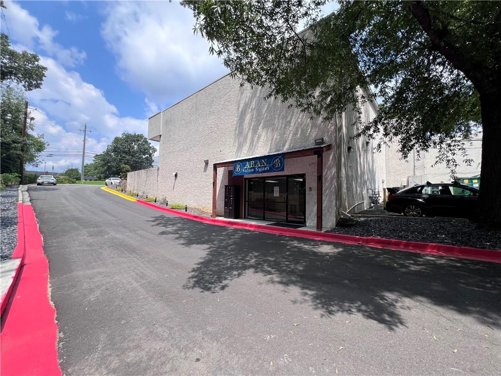 7855 Roswell Road Atlanta, GA 30350 - Photo 2 of 24 a view of street along with trees