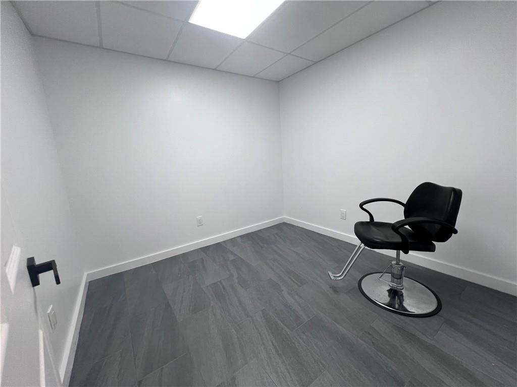 7855 Roswell Road Atlanta, GA 30350 - Photo 21 of 24 a view of a room with wooden floor and fan