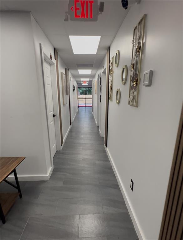 7855 Roswell Road Atlanta, GA 30350 - Photo 23 of 24 a view of a hallway with wooden floor