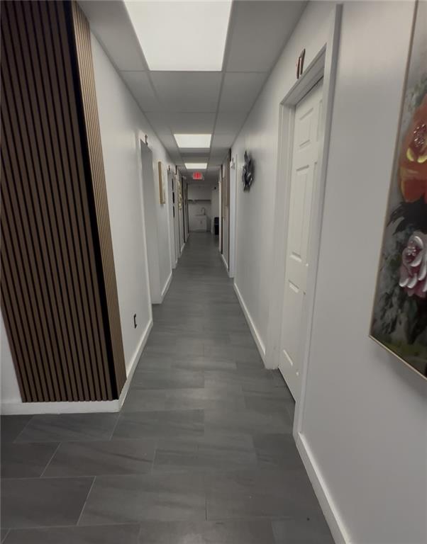 7855 Roswell Road Atlanta, GA 30350 - Photo 24 of 24 a view of a hallway with wooden floor and stairs
