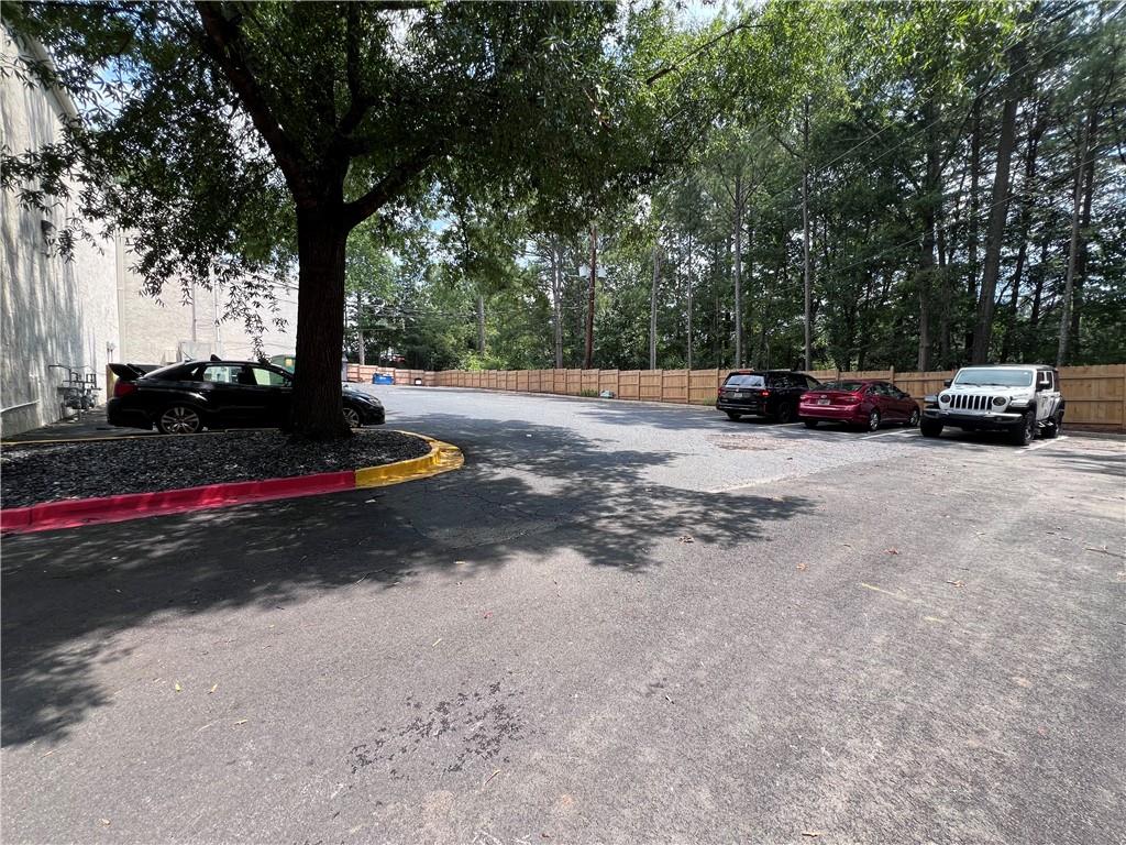 7855 Roswell Road Atlanta, GA 30350 - Photo 3 of 24 a view of street with parked cars