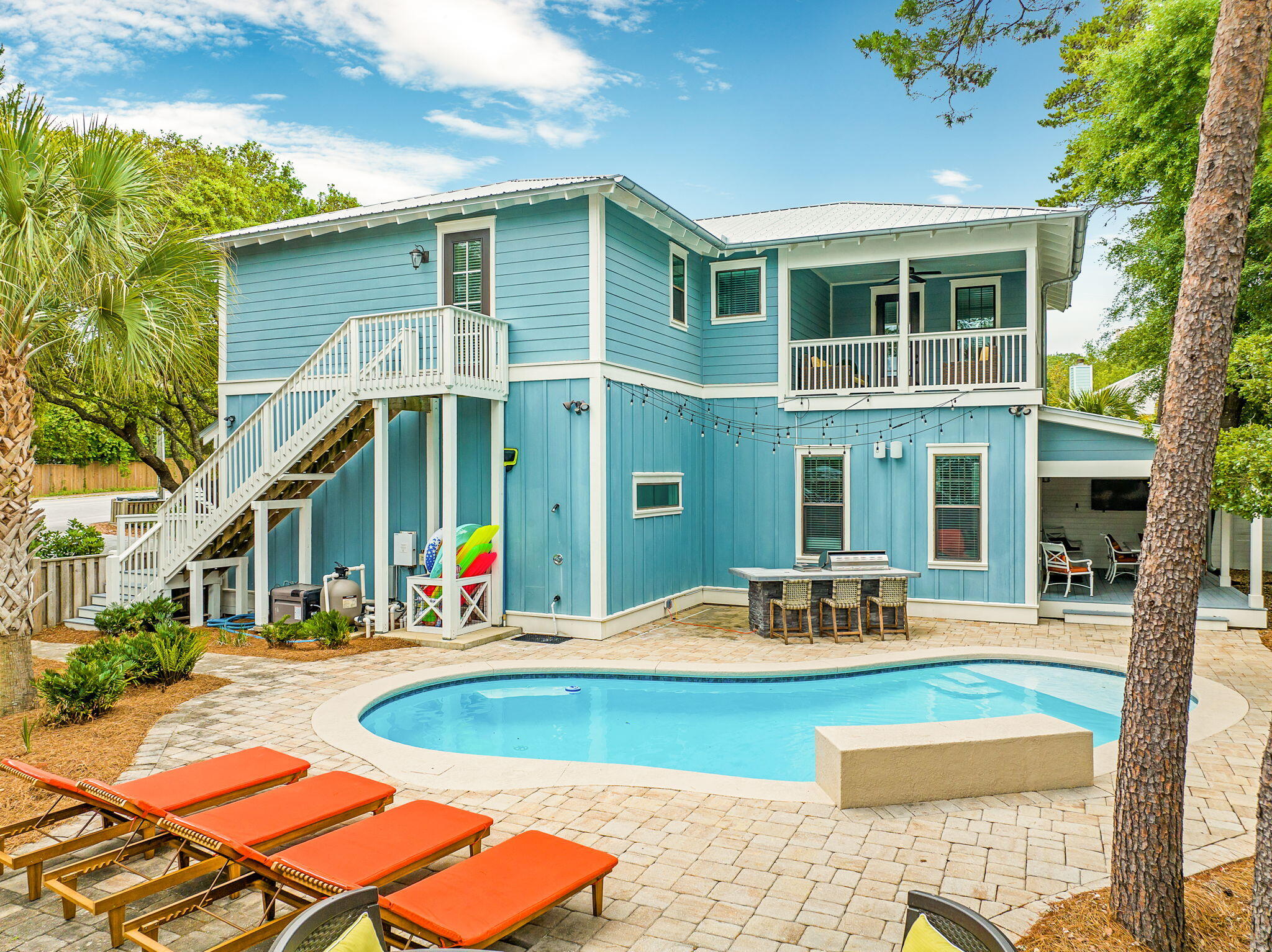 2846 South County Highway 395 Santa Rosa Beach, FL 32459 - Photo 4 of 19 a view of a patio with swimming pool table and chairs