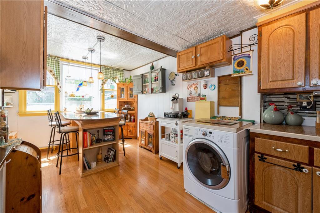 358 74th Street Brooklyn, NY 11209 - Photo 13 of 41 a view of a kitchen with furniture and wooden floor
