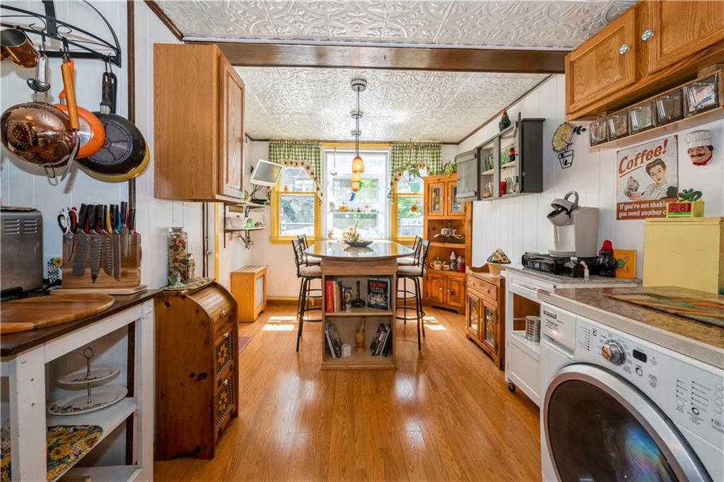 358 74th Street Brooklyn, NY 11209 - Photo 14 of 41 a view of a kitchen with furniture and wooden floor