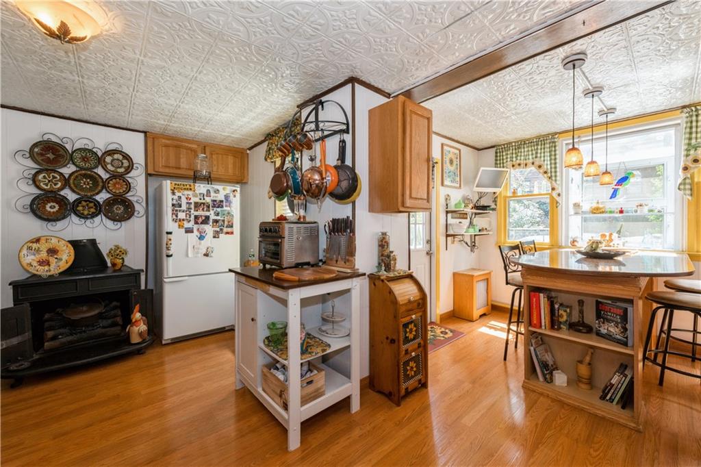 358 74th Street Brooklyn, NY 11209 - Photo 15 of 41 a kitchen with stainless steel appliances granite countertop a stove and a refrigerator