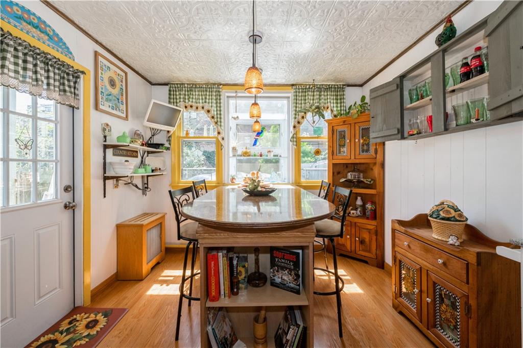 358 74th Street Brooklyn, NY 11209 - Photo 16 of 41 a view of a dining room with furniture window and wooden floor