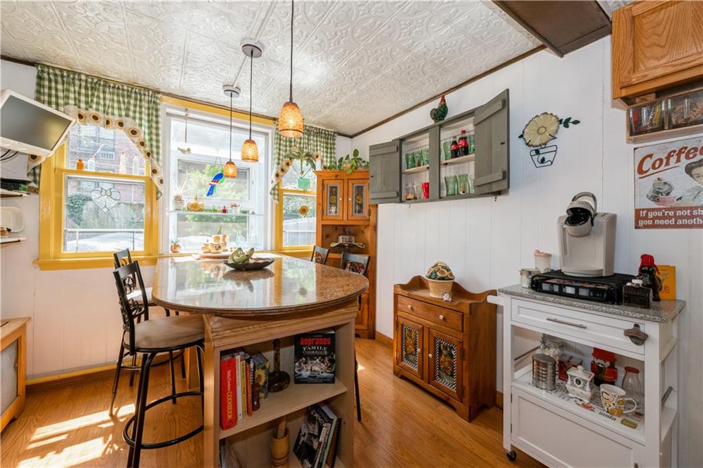 358 74th Street Brooklyn, NY 11209 - Photo 17 of 41 a dining room with furniture and window