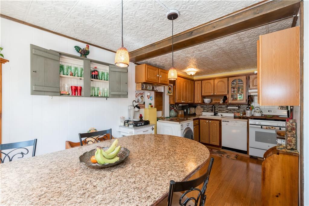 358 74th Street Brooklyn, NY 11209 - Photo 18 of 41 a kitchen with sink and refrigerator