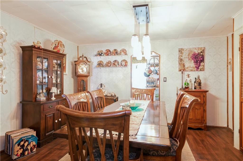 358 74th Street Brooklyn, NY 11209 - Photo 3 of 41 a dining room with furniture a chandelier and wooden floor
