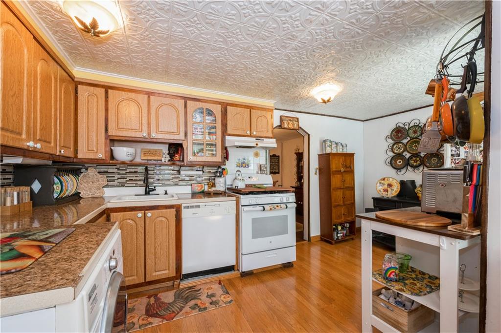 358 74th Street Brooklyn, NY 11209 - Photo 4 of 41 a kitchen with stainless steel appliances granite countertop a refrigerator and a stove top oven