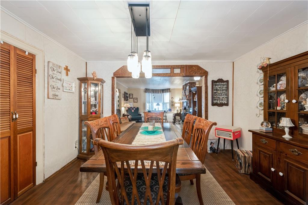358 74th Street Brooklyn, NY 11209 - Photo 9 of 41 a dining room with furniture a chandelier and wooden floor