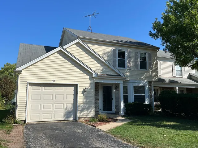 a view of house with yard