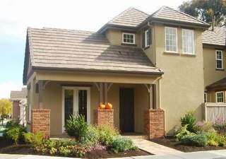 49 Hollyleaf Way Novato, CA 94949 - Photo 3 of 6 a view of a white house with large windows and plants