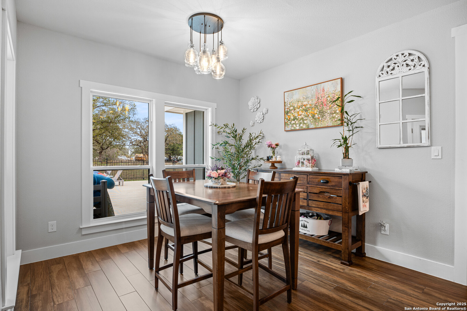 104 Archer Ridge Drive La Vernia, TX 78121 - Photo 14 of 45 a view of a dining room with furniture window and wooden floor