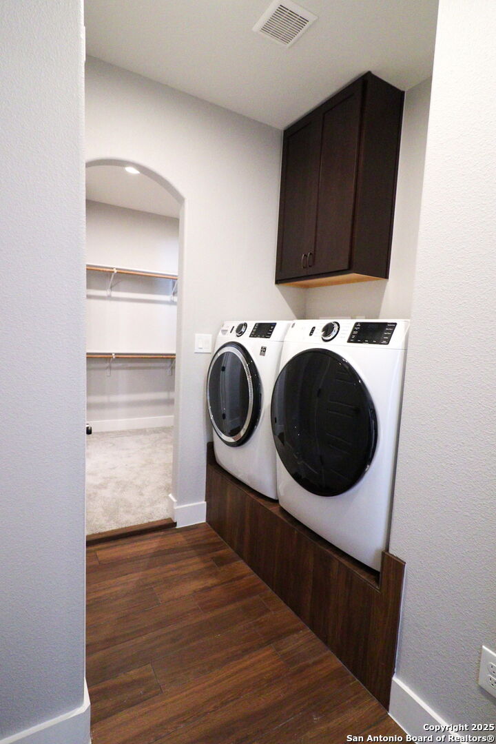 104 Archer Ridge Drive La Vernia, TX 78121 - Photo 25 of 45 a utility room with wooden floor washer and dryer