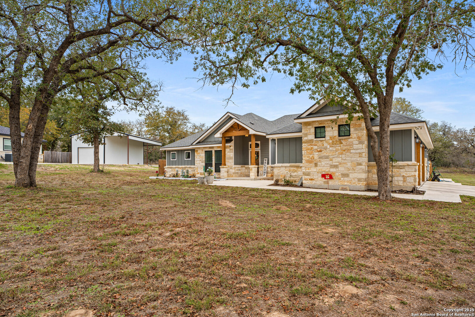 104 Archer Ridge Drive La Vernia, TX 78121 - Photo 3 of 45 a front view of a house with a garden