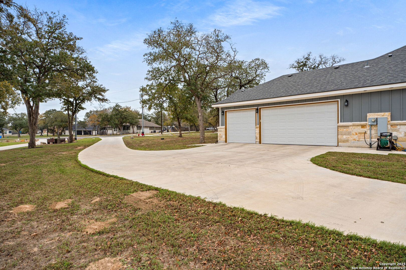 104 Archer Ridge Drive La Vernia, TX 78121 - Photo 39 of 45 a view of a white house with a yard and garage