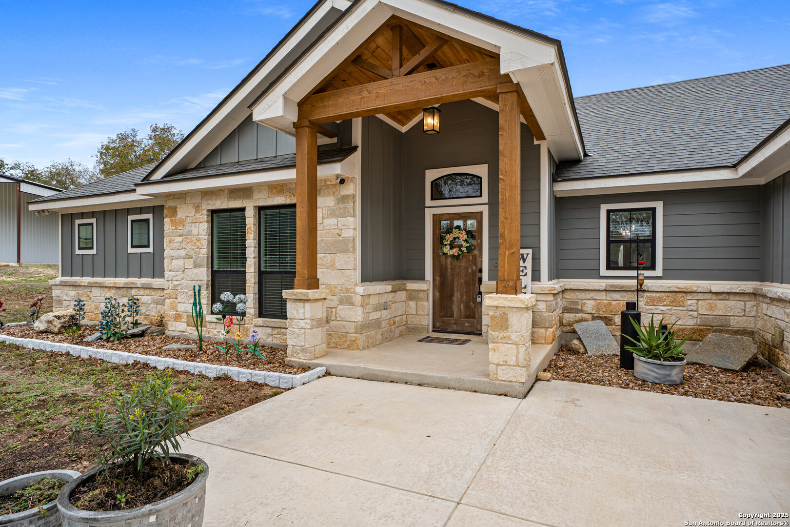104 Archer Ridge Drive La Vernia, TX 78121 - Photo 4 of 45 a front view of a house with garden