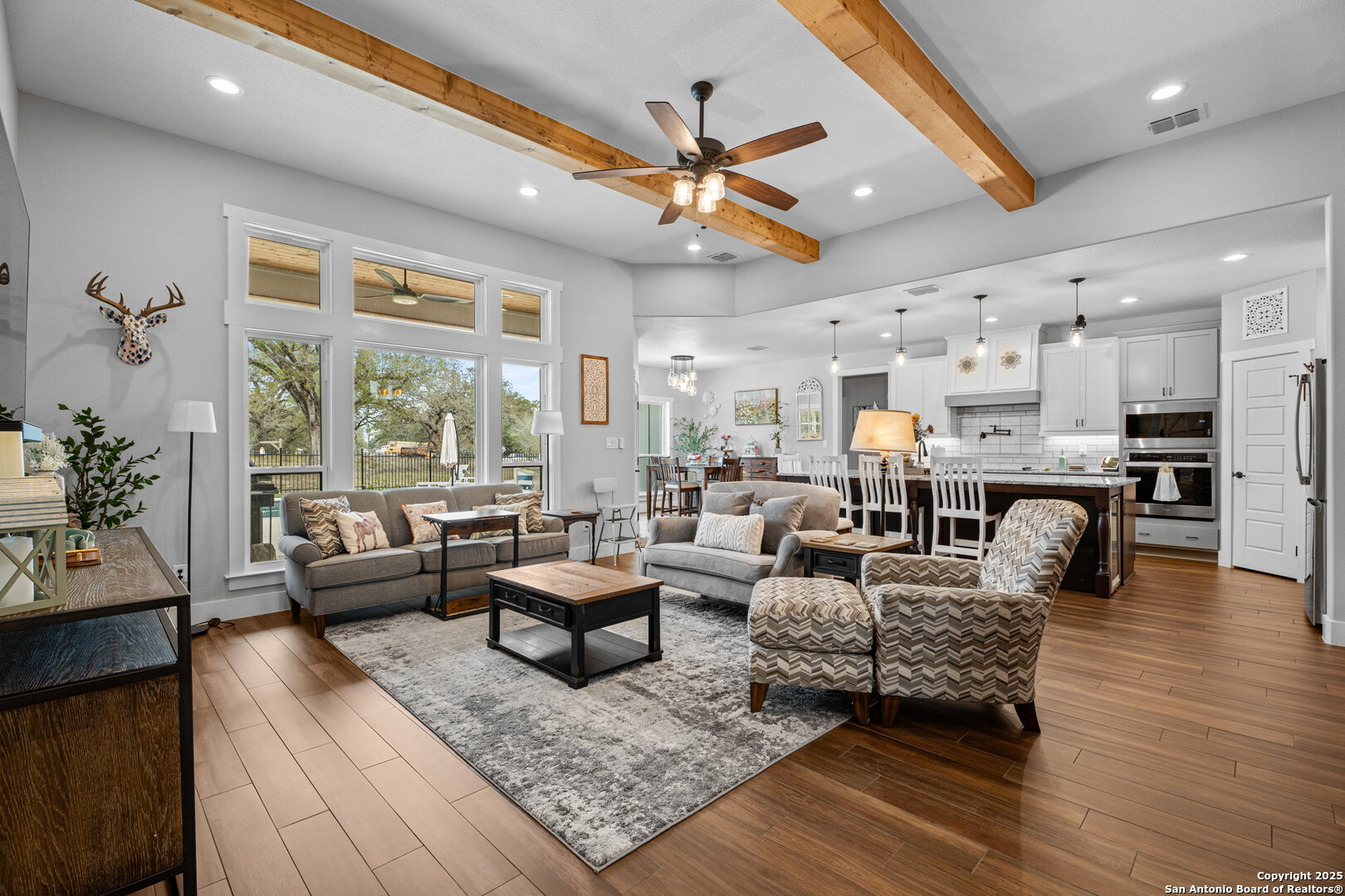104 Archer Ridge Drive La Vernia, TX 78121 - Photo 6 of 45 a living room with furniture kitchen view and a large window