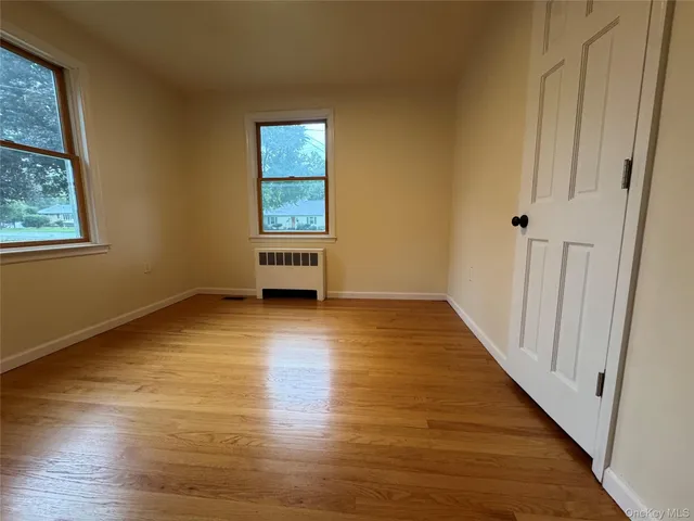 a bathroom with a toilet and a mirror