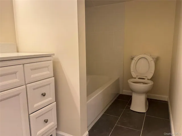 a bathroom with a double vanity sink and mirror