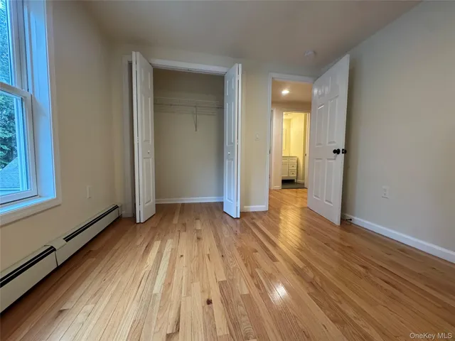 a view of a room with wooden floor and stairs